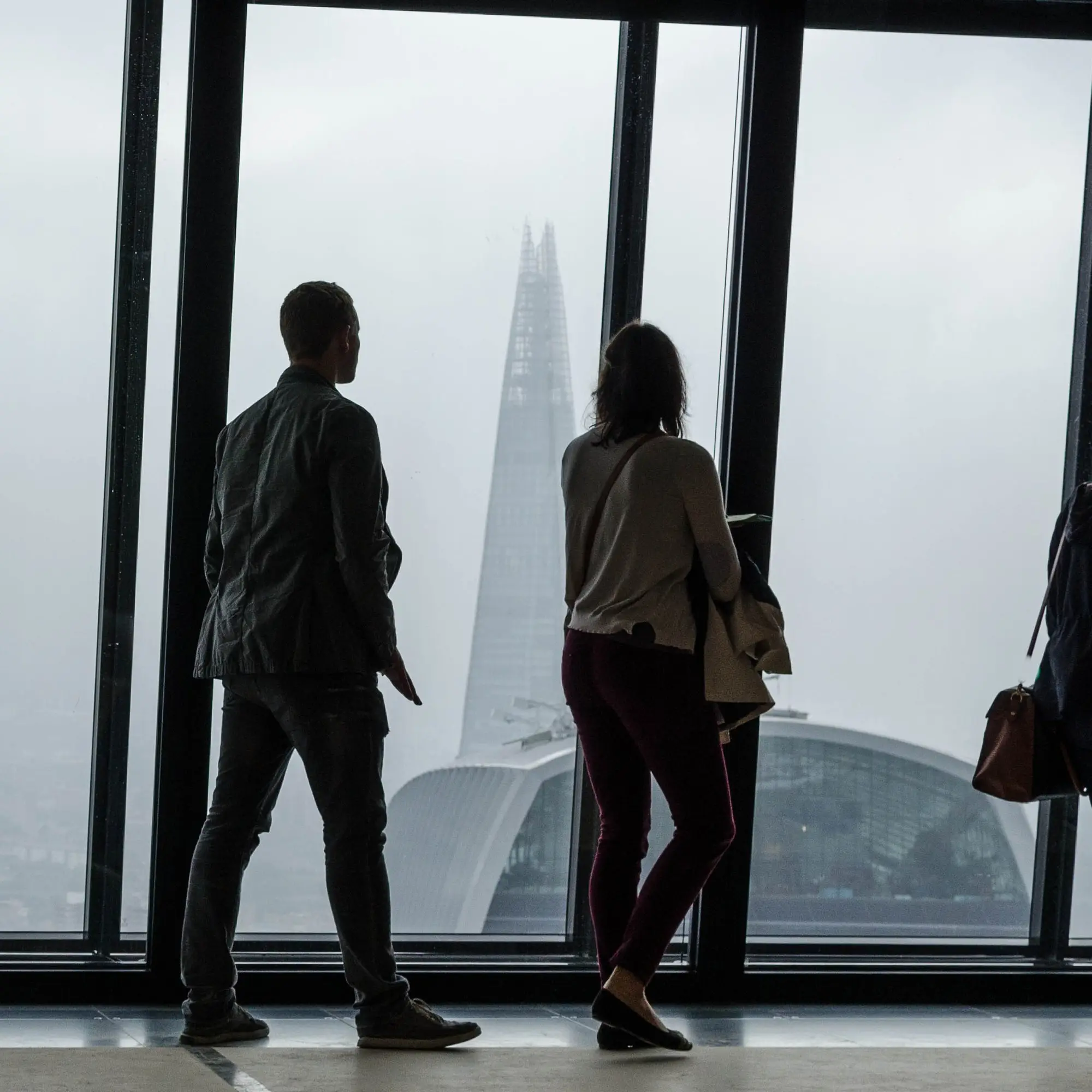 VeloBridge team members in conversation by a window